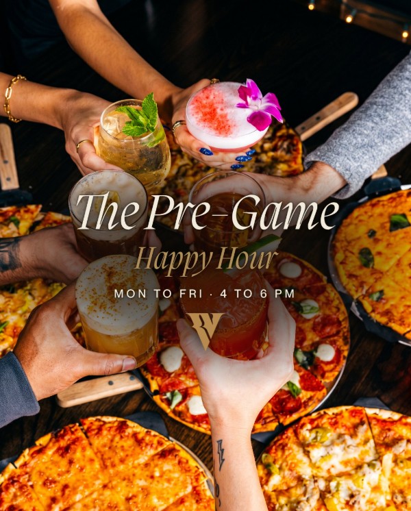 Friends raising cocktails and beers over a table of pizzas, with The Pre-Game Happy Hour, Monday to Friday 4 to 6 PM.