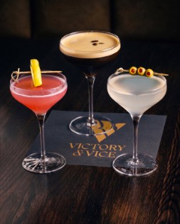 A Lemon Drop, an Espresso Martini and a Dirty Martini on a Victory & Vice napkin.
